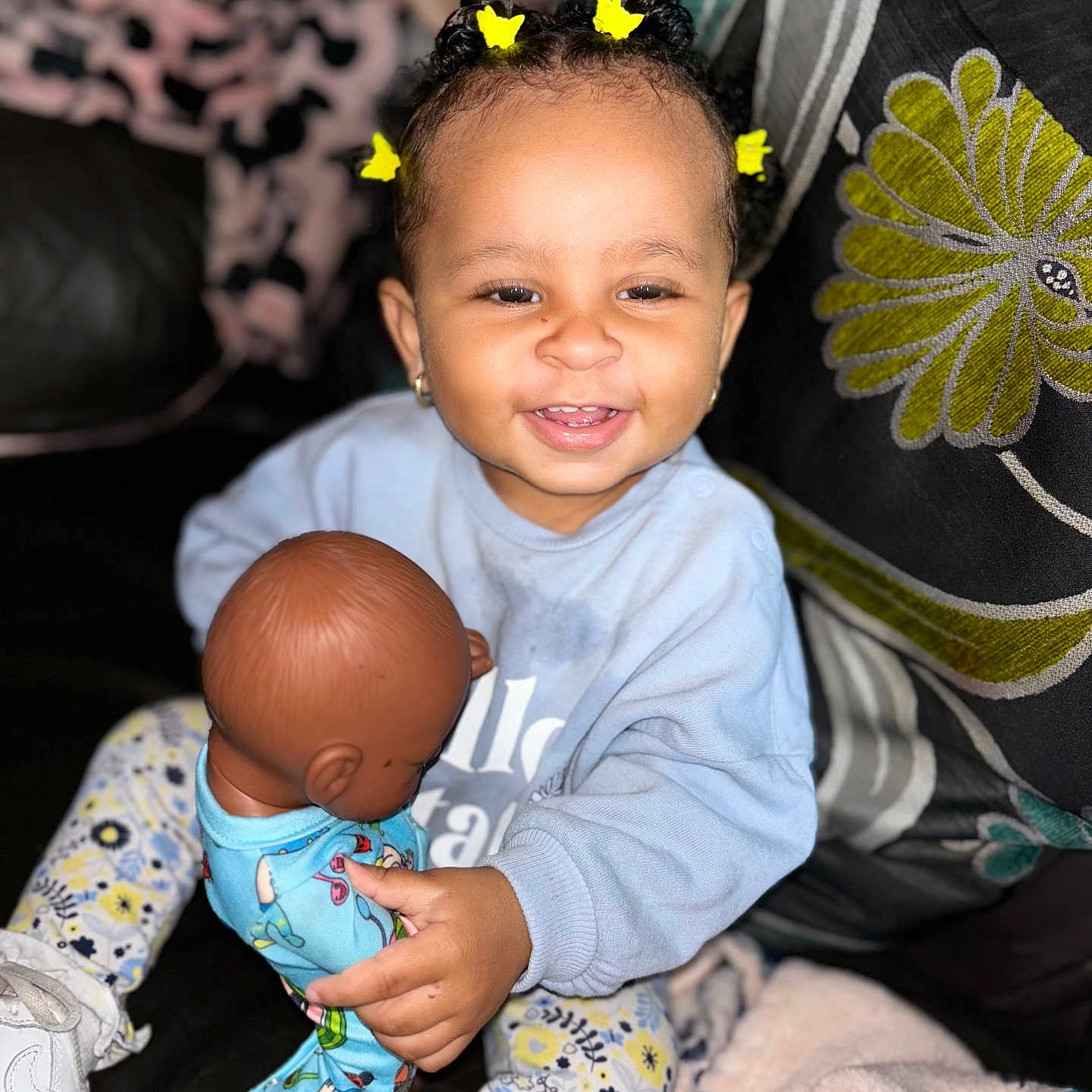 Seraya is registered to the contest to win money with this photo: baby, babylaughing, clothing, couch, cushion, face, footwear, furniture, happy, head, homedecor, laughing, pants, person, photography, portrait, shoe, sitting, smile, toy