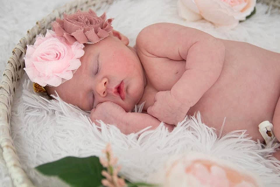 Emmarie joined the competition — help win amazing prizes! baby, baby_sleeping, baby_toddler_clothing, bedding, cheek, comfort, face, facial_expression, flower, hand, happy, head, headgear, headpiece, headwear, linens, mammal, mouth, person, skin