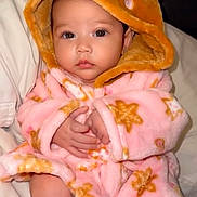Aulani joined the competition — help win amazing prizes! baby, infant, hood, robe, pink, star_pattern, blanket, bed, eyes, hands, skin, cute, cozy, plush, portrait, closeup, pajamas, sitting, soft_texture, looking_at_camera
