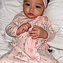 Aulani is registered to the contest to win money with this photo: baby, infant, child, headband, pink, onesie, pajamas, soft_bedding, lying_down, hands, big_eyes, dark_hair, closeup, portrait, cute, sleepwear, ruffle, pacifier_clip, blanket, calm