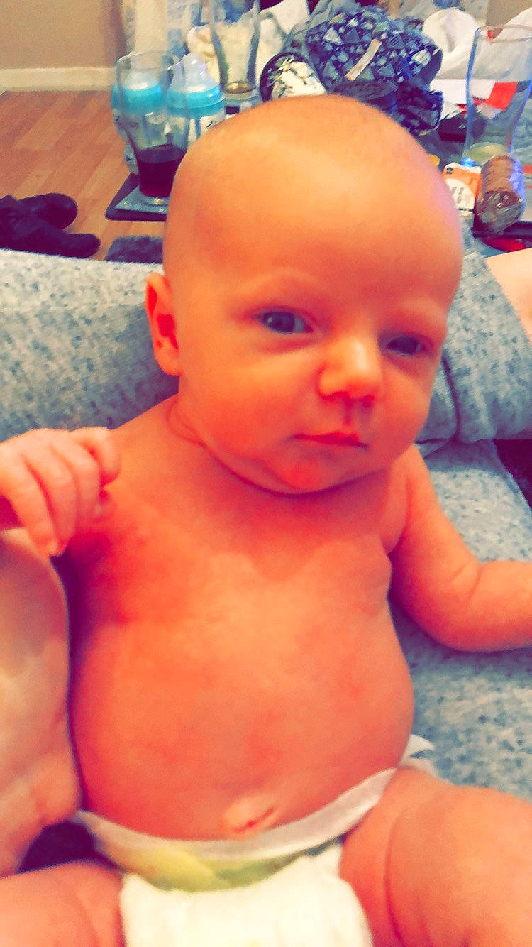 Vinnie is registered to the contest to win money with this photo: abdomen, cheek, child, ear, face, finger, forehead, hand, head, infant, lip, mouth, muscle, person, skin, toddler