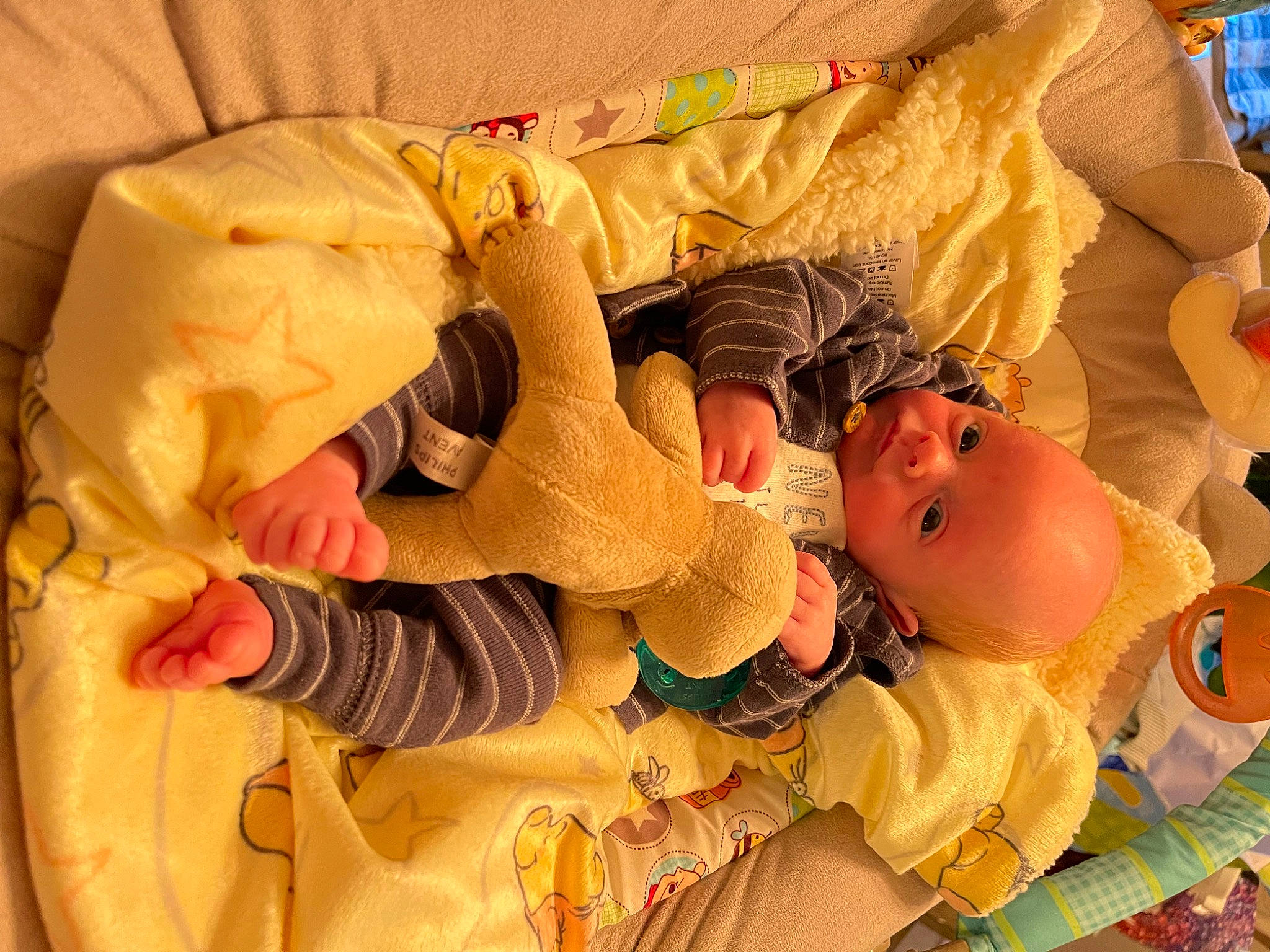 Kody is registered to the contest to win money with this photo: baby, baby_products, baby_safety, baby_sleeping, baby_toddler_clothing, bedding, bedtime, cheek, child, comfort, happy, linens, orange, pattern, peach, person, room, sleep, textile, toddler