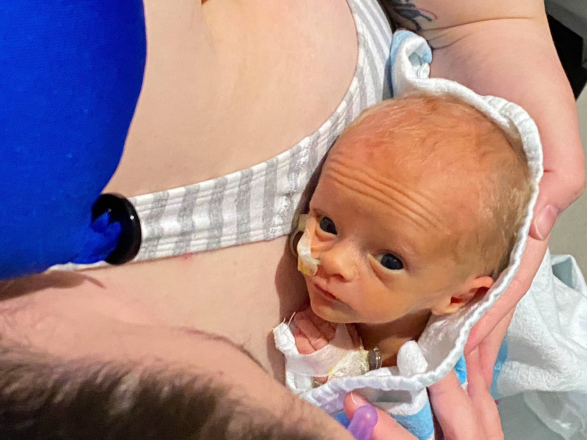 Kody is registered to the contest to win money with this photo: abdomen, baby, cheek, chest, child, comfort, elbow, eyelash, finger, gesture, happy, human, human_leg, interaction, joint, mouth, person, skin, thigh, toddler