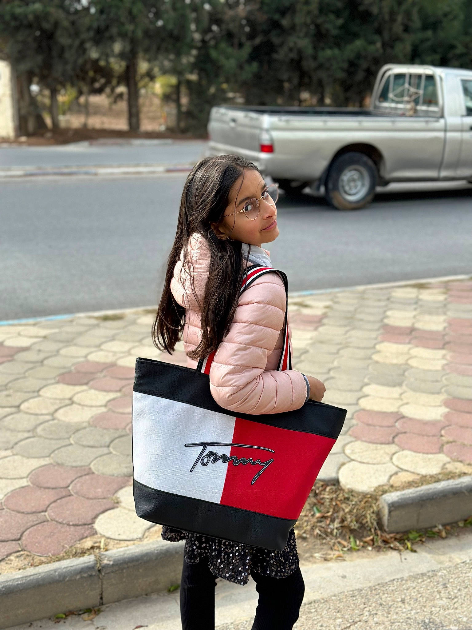 Neha-rose participe au concours pour gagner de l'argent avec cette photo : asphalt, bag, car, coupe_utility, denim, eyewear, knee, luggage_and_bags, person, photograph, road, road_surface, sleeve, t_shirt, thigh, tire, truck, vehicle, vehicle_door, waist