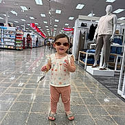Emma Sophia joined the competition — help win amazing prizes! toddler, child, sunglasses, store, shopping, mannequin, clothing, aisle, floor, footwear, person, retail, casual_wear, tag, bracelet, pants, top, indoor, shopping_cart, display