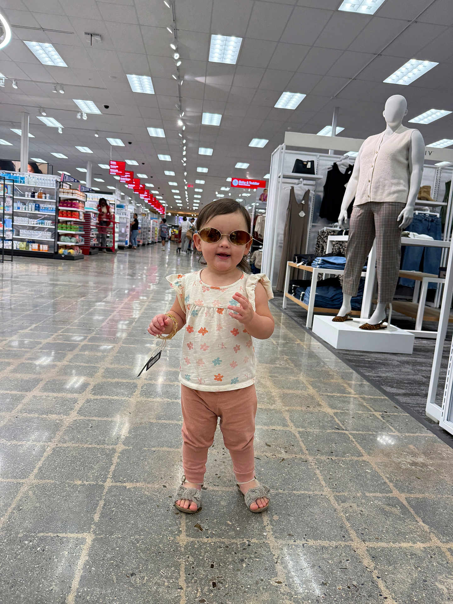 Emma Sophia joined the competition — help win amazing prizes! toddler, child, sunglasses, store, shopping, mannequin, clothing, aisle, floor, footwear, person, retail, casual_wear, tag, bracelet, pants, top, indoor, shopping_cart, display