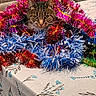 animal, cat, christmas, colorful, decoration, ears, eyes, feline, festive, garland, holiday, indoors, pet, portrait, sparkly, tabby_cat, table, tablecloth, tinsel, whiskers