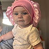 Mckenna is registered to the contest to win money with this photo: baby, child, infant, portrait, face, eyes, pink_bonnet, bonnet, baby_clothing, yellow_shirt, sitting, indoor, home, warm_lighting, soft_focus, close_up, person, lap, adorable, photography
