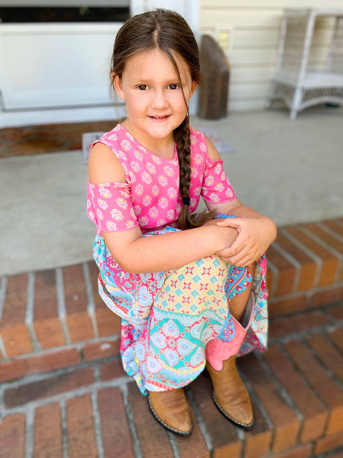 Emeri is registered to the contest to win money with this photo: baby_toddler_clothing, eye, face, floor, flooring, hair, happy, head, human_body, human_leg, iris, joy, neck, person, pink, shoulder, skin, sleeve, smile, thigh