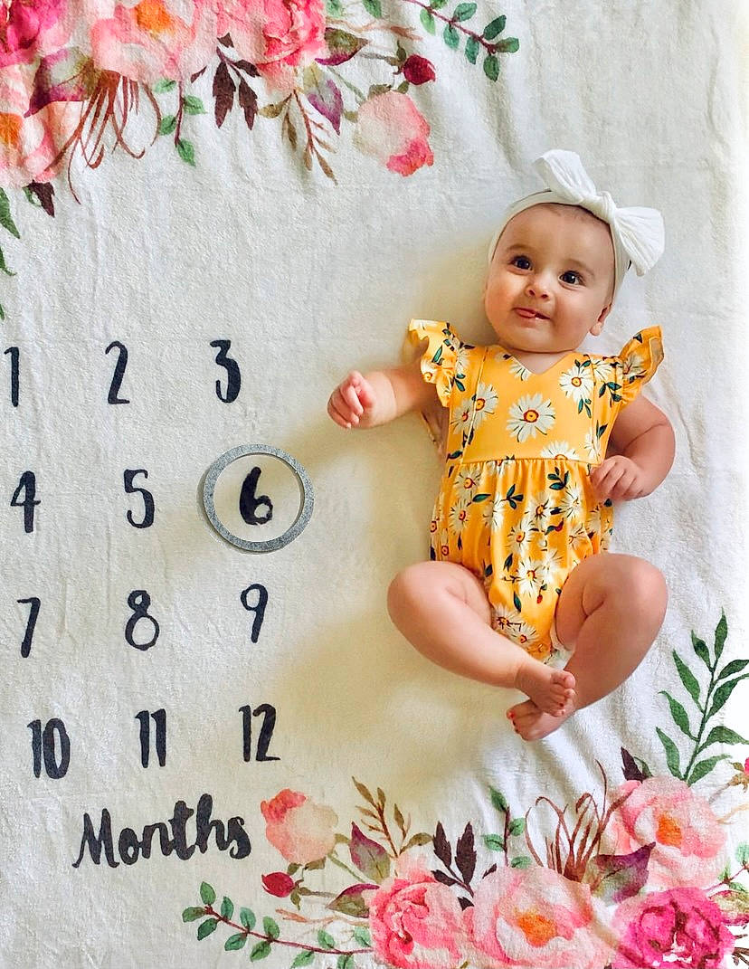 Oakleigh joined the competition — help win amazing prizes! baby, baby_toddler_clothing, beauty, child, facial_expression, flower, font, happy, joy, leaf, orange, pattern, peach, person, petal, pink, plant, product, smile, textile