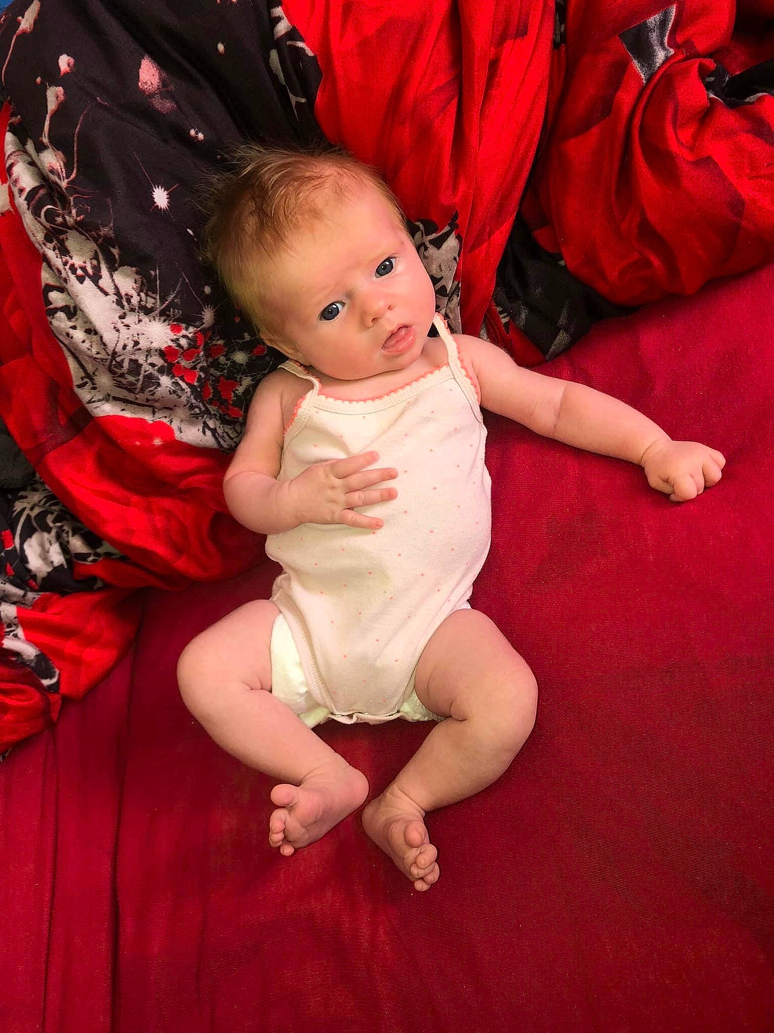 Shelsy participe au concours pour gagner de l'argent avec cette photo : abdomen, baby, baby_toddler_clothing, comfort, dress, flash_photography, flooring, foot, fun, gesture, happy, human_leg, person, pink, red, skin, thigh, thumb, toddler, trunk