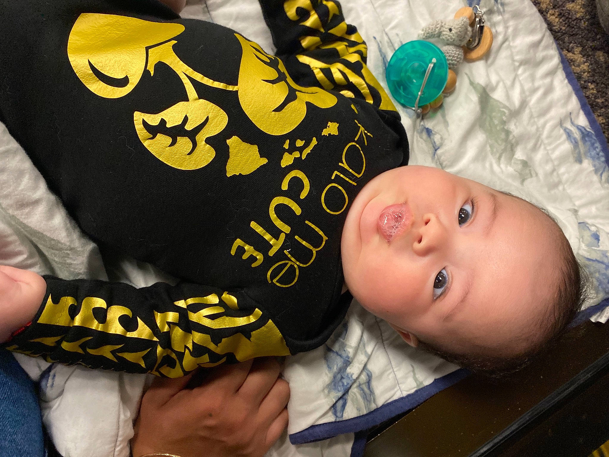 Brycen is registered to the contest to win money with this photo: baby, baby_toddler_clothing, cheek, child, facial_expression, finger, font, fun, gesture, hand, happy, headgear, illustration, pattern, person, room, sleeve, t_shirt, thumb, toddler