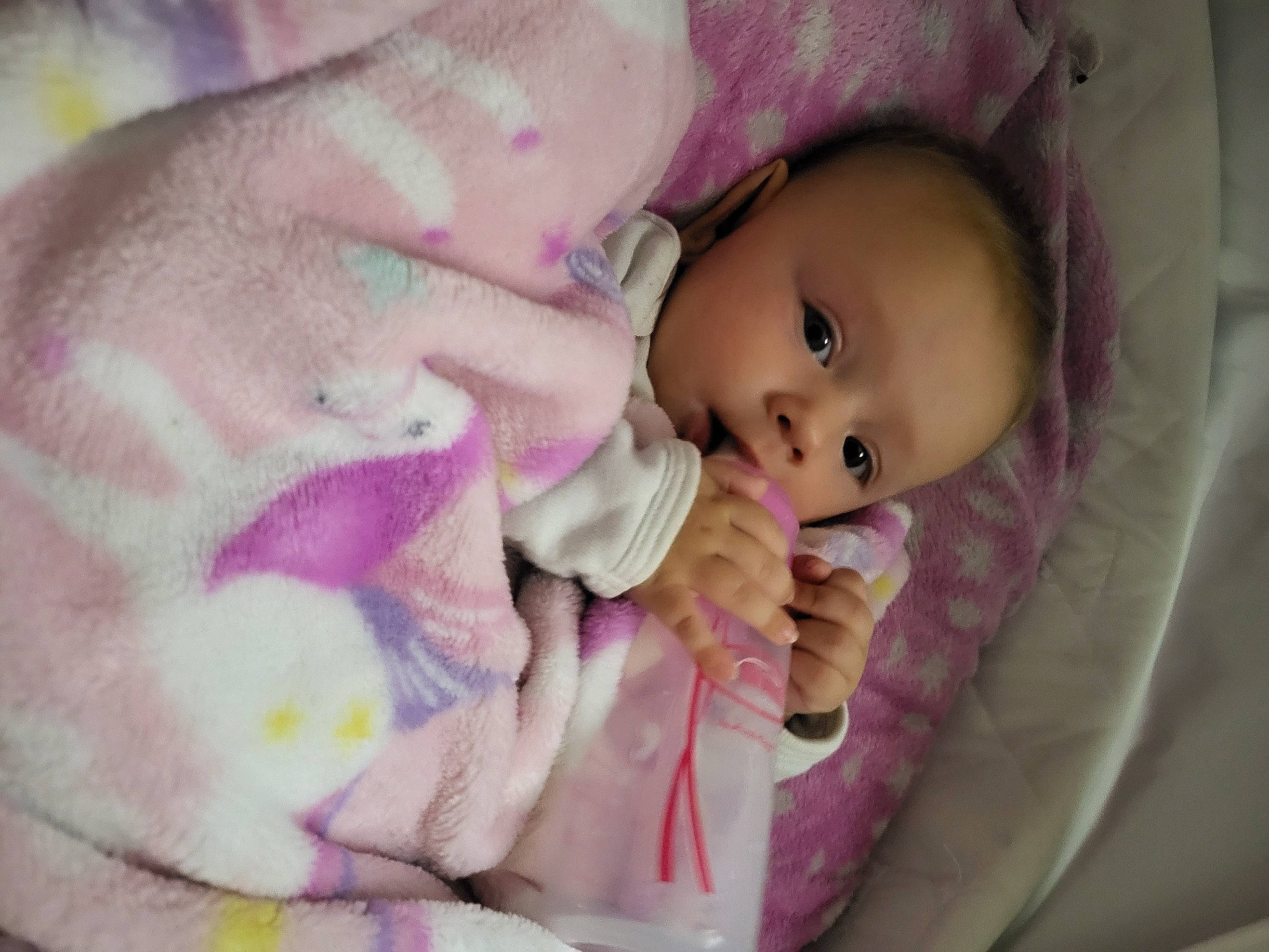 Octavia joined the competition — help win amazing prizes! baby, baby_products, baby_toddler_clothing, cheek, child, close_up, comfort, eye, eyelash, face, facial_expression, head, human_body, linens, lip, nose, person, pink, purple, skin