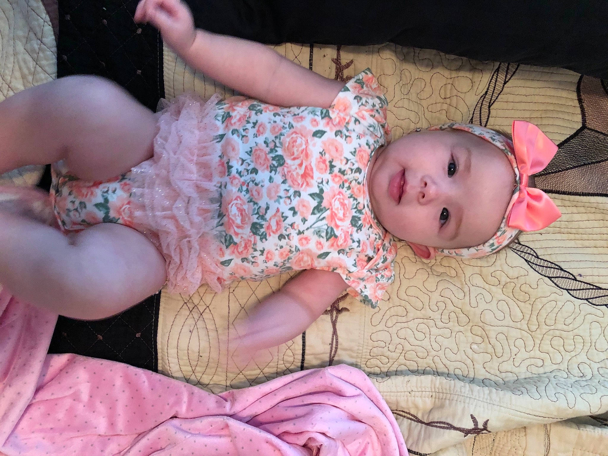 Paisley joined the competition — help win amazing prizes! arm, baby, baby_toddler_clothing, child, comfort, day_dress, dress, finger, head, headwear, human_body, human_leg, joint, leg, pattern, person, pink, skin, textile, thigh