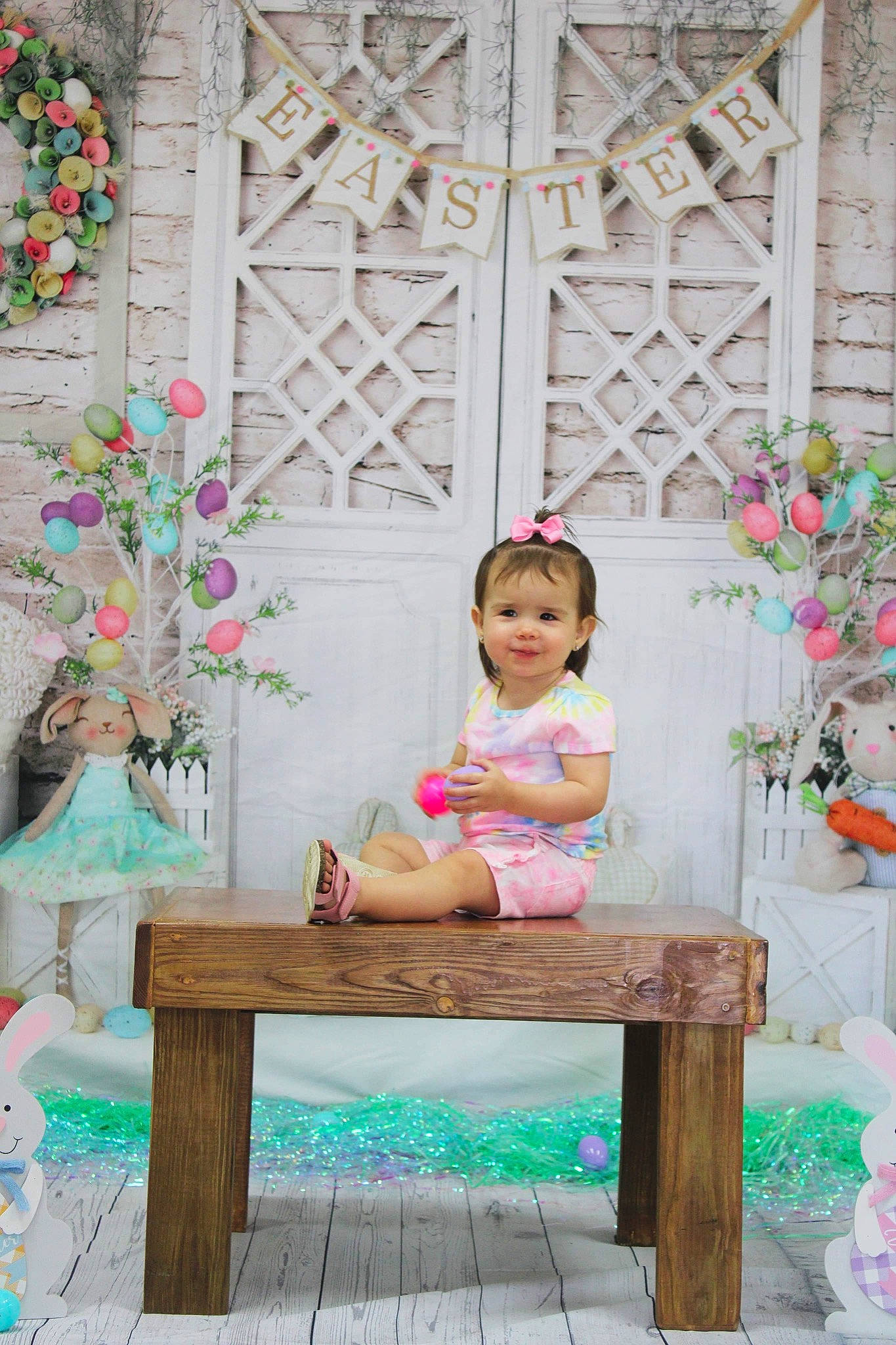 Paisley is registered to the contest to win money with this photo: baby_toddler_clothing, beauty, botany, dress, flower, green, happy, joy, leaf, leisure, magenta, outdoor_furniture, person, photograph, pink, plant, summer, textile, toddler, tree
