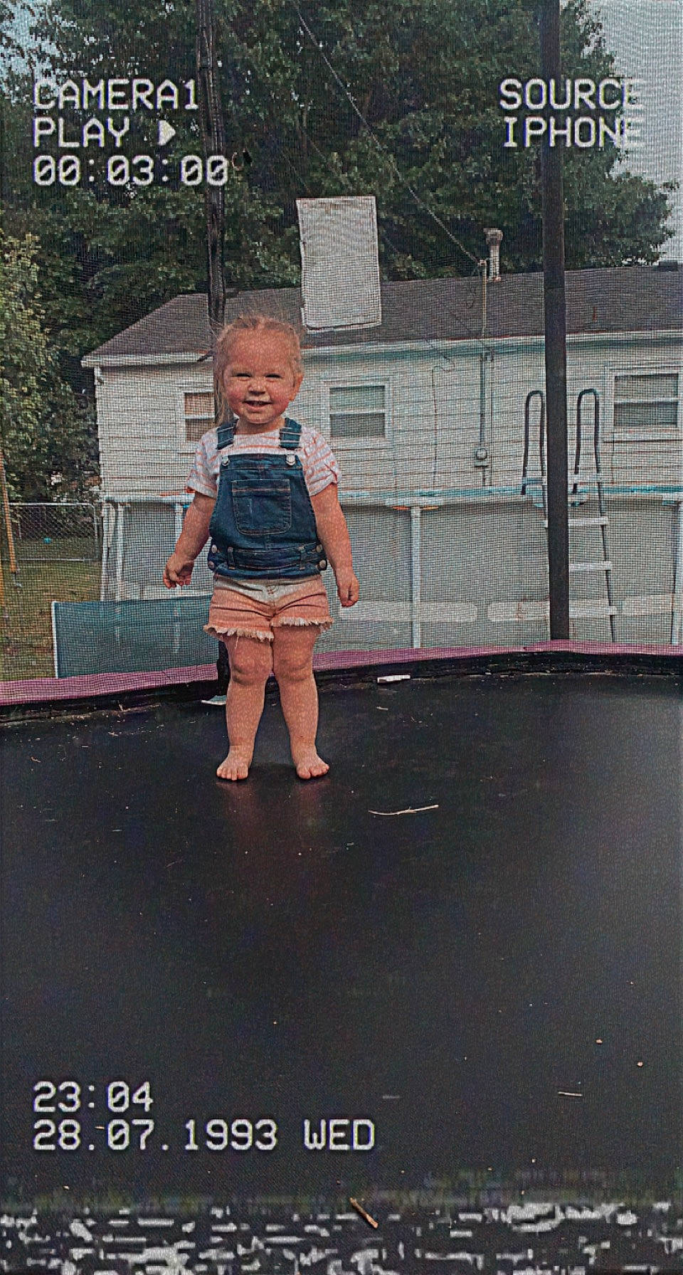 Addilynn joined the competition — help win amazing prizes! asphalt, denim, fence, flooring, fun, human_leg, leisure, magenta, pattern, person, photo_caption, play, puddle, rectangle, road_surface, t_shirt, tints_and_shades, toddler, trampolining_equipment_and_supplies, tree