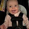 Kensley joined the competition — help win amazing prizes! baby, baby_girl, car_seat, child, child_safety, cute, face, happy, head, indoor, infant, infant_clothing, person, pink_clothing, portrait, safety_harness, seatbelt, smile, tongue_out, warning_label