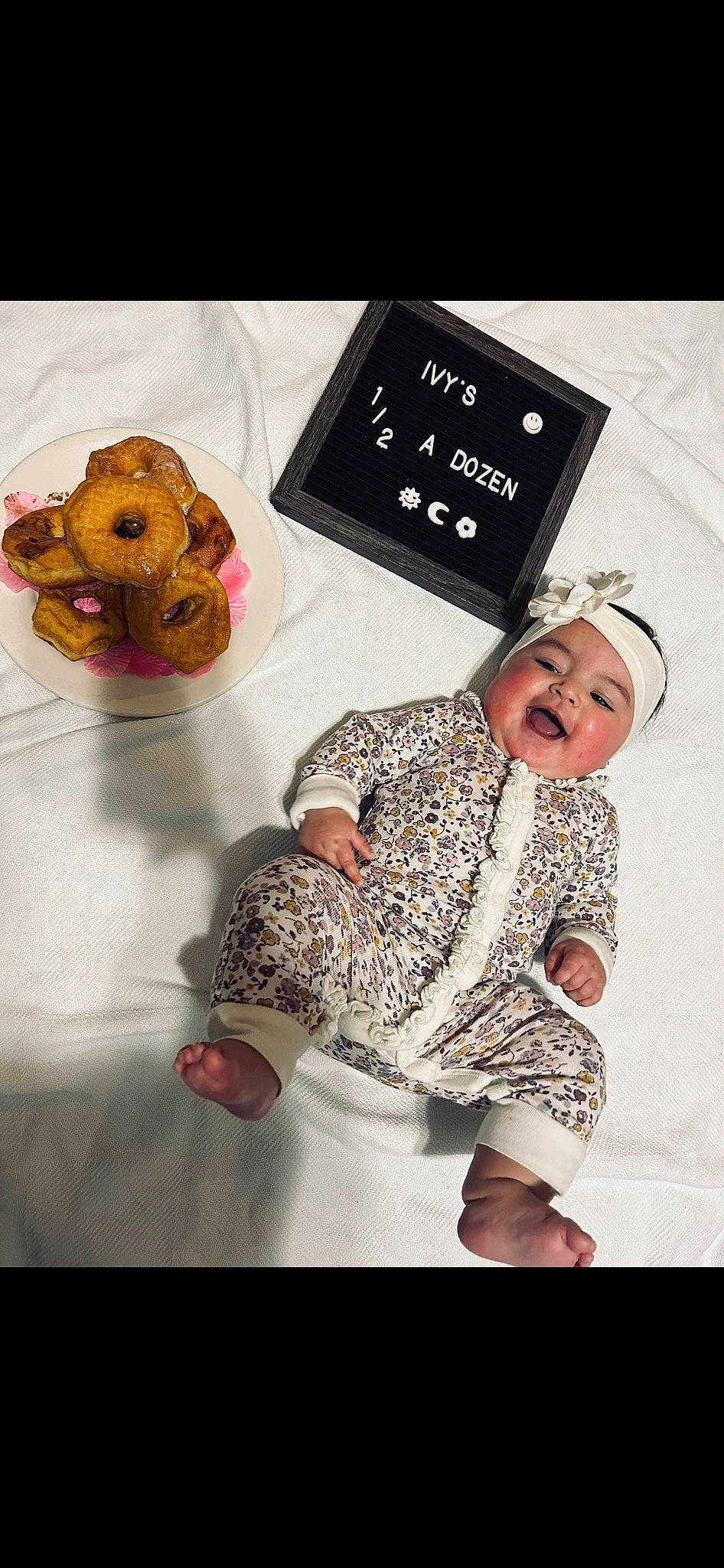 Ivy is registered to the contest to win money with this photo: baby, baby_toddler_clothing, baking, cuisine, event, facial_expression, fashion_design, finger_food, flash_photography, font, food, happy, headwear, ingredient, pattern, person, recipe, sleeve, smile, stuffed_toy