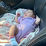 baby, sleeping, car_seat, blanket, onesie, socks, interior, car, door, water_bottle, leather, seat, infant, child, resting, cute, soft, pink, striped, peaceful