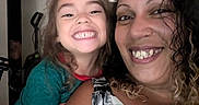 Gage is registered to the contest to win money with this photo: casual, child, closeup, curly_hair, face, family, hair, happy, human, indoor, joy, nose_ring, people, person, portrait, smile, toddler, together, tshirt, woman