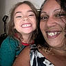 Gage is registered to the contest to win money with this photo: child, woman, smile, happy, portrait, indoor, curly_hair, nose_ring, family, closeup, casual, person, toddler, joy, tshirt, hair, face, human, people, together