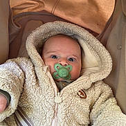 Ziyad participe au concours pour gagner de l'argent avec cette photo : baby, infant, pacifier, hoodie, car_seat, seatbelt, clothing, blanket, child, cute, warm, indoor, portrait, person, face, young_child, expression, comfort, safety, bundle