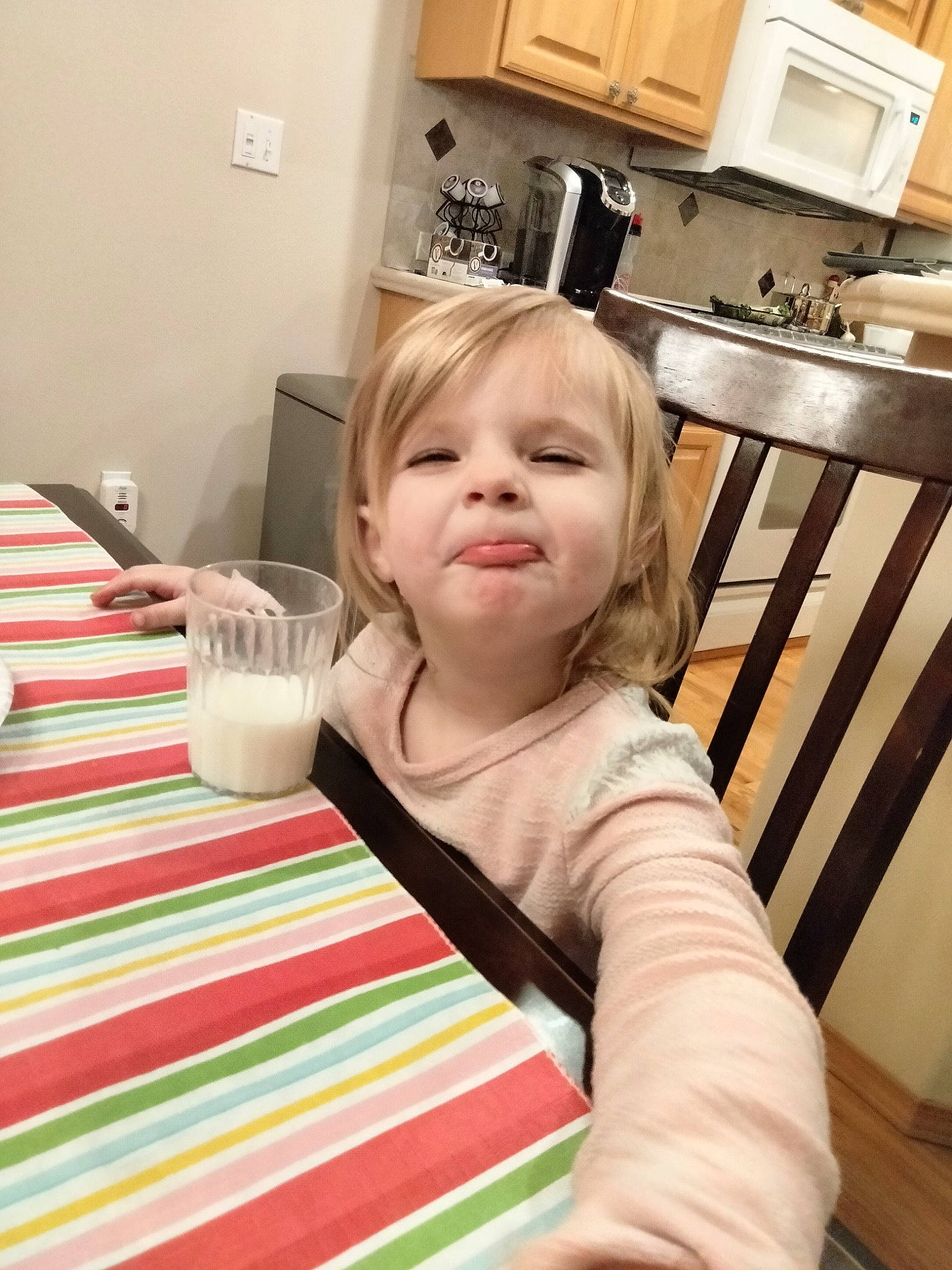 Airianna is registered to the contest to win money with this photo: baby_toddler_clothing, cabinetry, cooking, countertop, cup, flooring, hardwood, joy, kitchen, kitchen_appliance, kitchen_sink, kitchen_stove, person, plate, plumbing_fixture, serveware, sink, table, tableware, tap