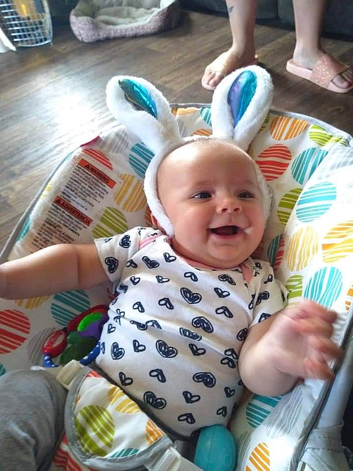 Airianna is registered to the contest to win money with this photo: baby, baby_products, baby_toddler_clothing, chair, child, event, foot, fun, happy, holiday, human_leg, leisure, pattern, person, play, sitting, smile, t_shirt, table, tableware