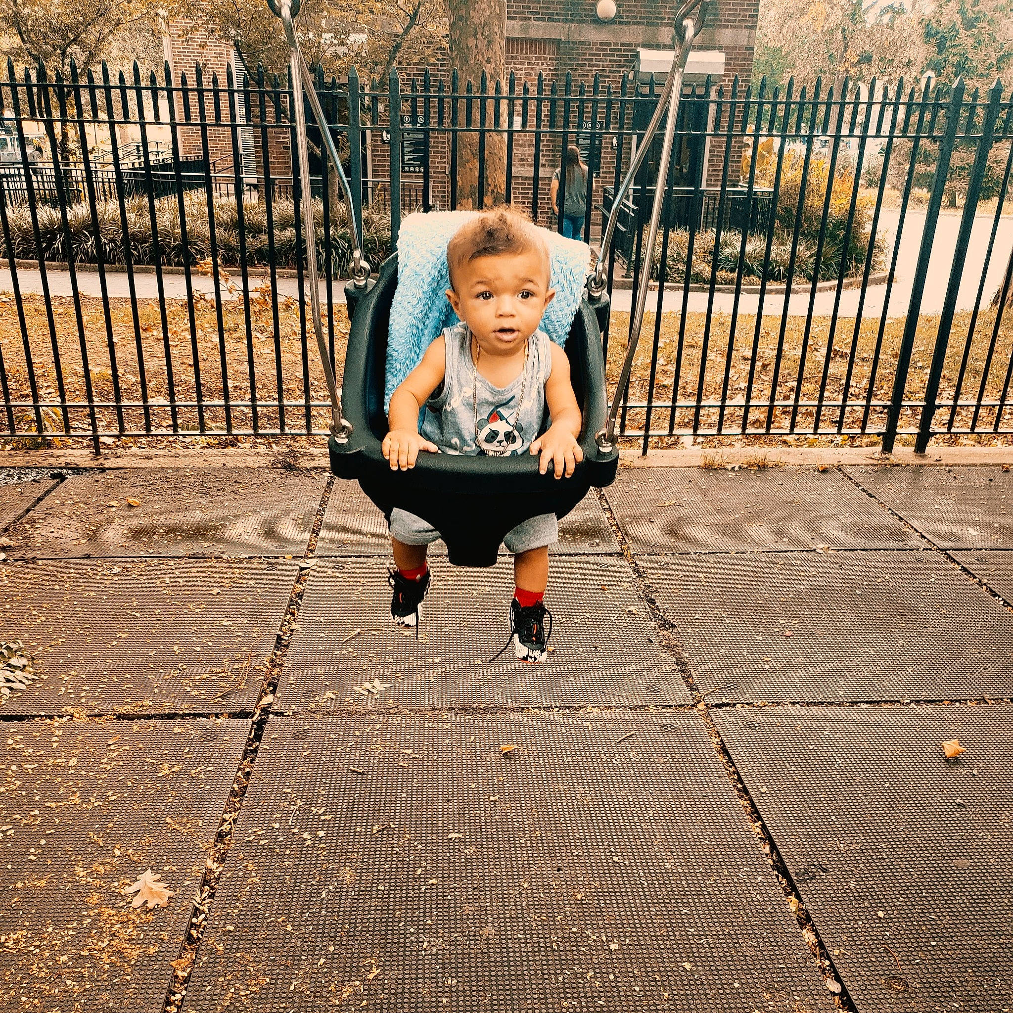 Grechniel is registered to the contest to win money with this photo: blond, child, cool, fun, happy, leg, outdoor_play_equipment, people, person, physical_fitness, play, playground, public_space, shoe, sitting, sky, smile, spring, swing, toddler