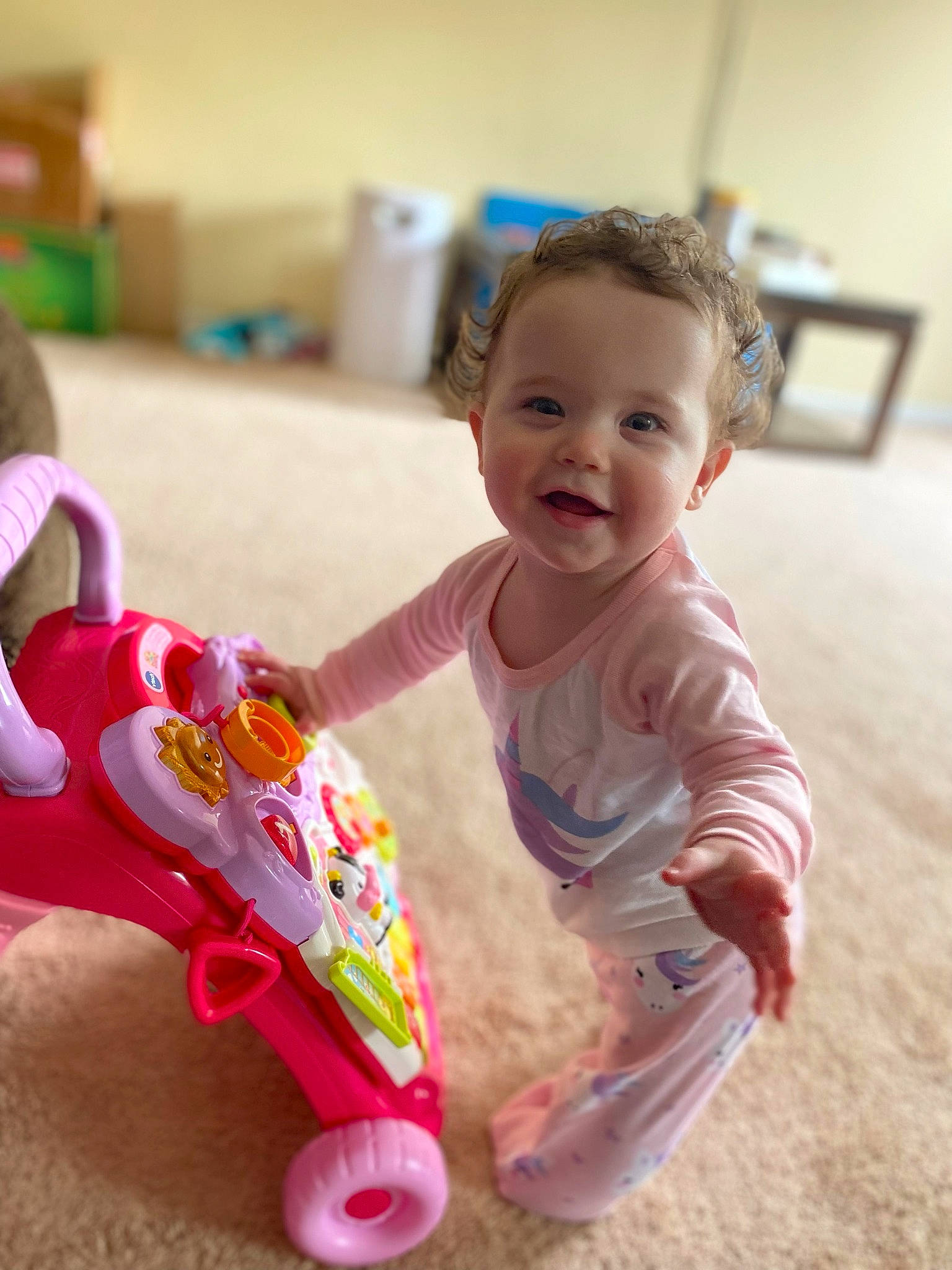 Charlotte Rose joined the competition — help win amazing prizes! baby, baby_playing_with_toys, baby_toddler_clothing, cheek, child, fun, hairstyle, happy, person, play, riding_toy, room, sitting, skin, smile, tire, toddler, toy, toy_vehicle, wheel
