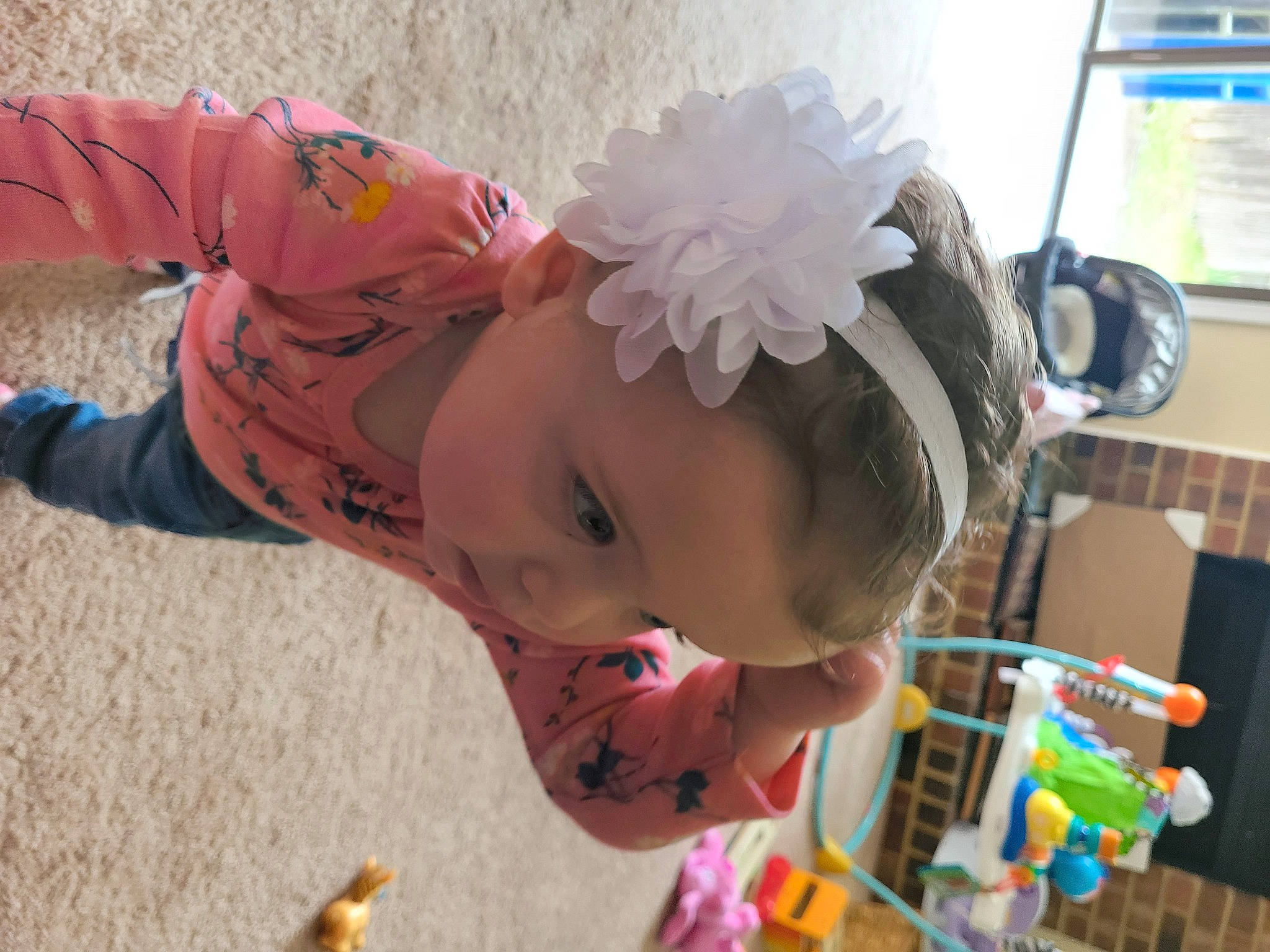 Charlotte Rose is registered to the contest to win money with this photo: baby, baby_products, baby_toddler_clothing, child, event, eyelash, fashion_accessory, fun, hair_accessory, happy, headband, headpiece, party_supply, pattern, person, pink, play, room, skin, toddler