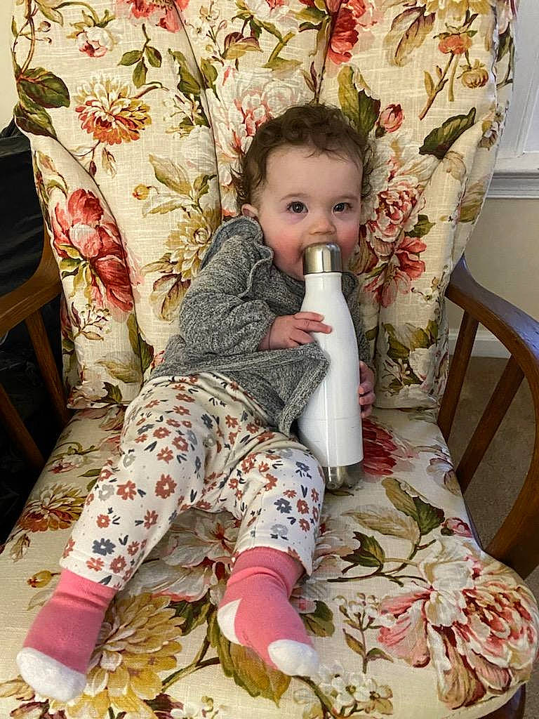 Charlotte Rose is registered to the contest to win money with this photo: arm, baby, baby_products, baby_toddler_clothing, chair, child, comfort, eye, human_body, linens, pattern, person, pink, product, sitting, skin, sleeve, textile, thigh, toddler