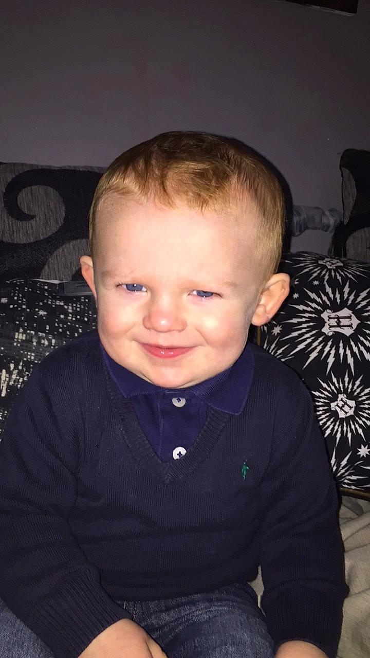 Jenson Aidan Wheeler is registered to the contest to win money with this photo: baby, cheek, child, chin, ear, eye, face, forehead, hair, hairstyle, head, iris, joy, lip, nose, person, sitting, skin, smile, toddler