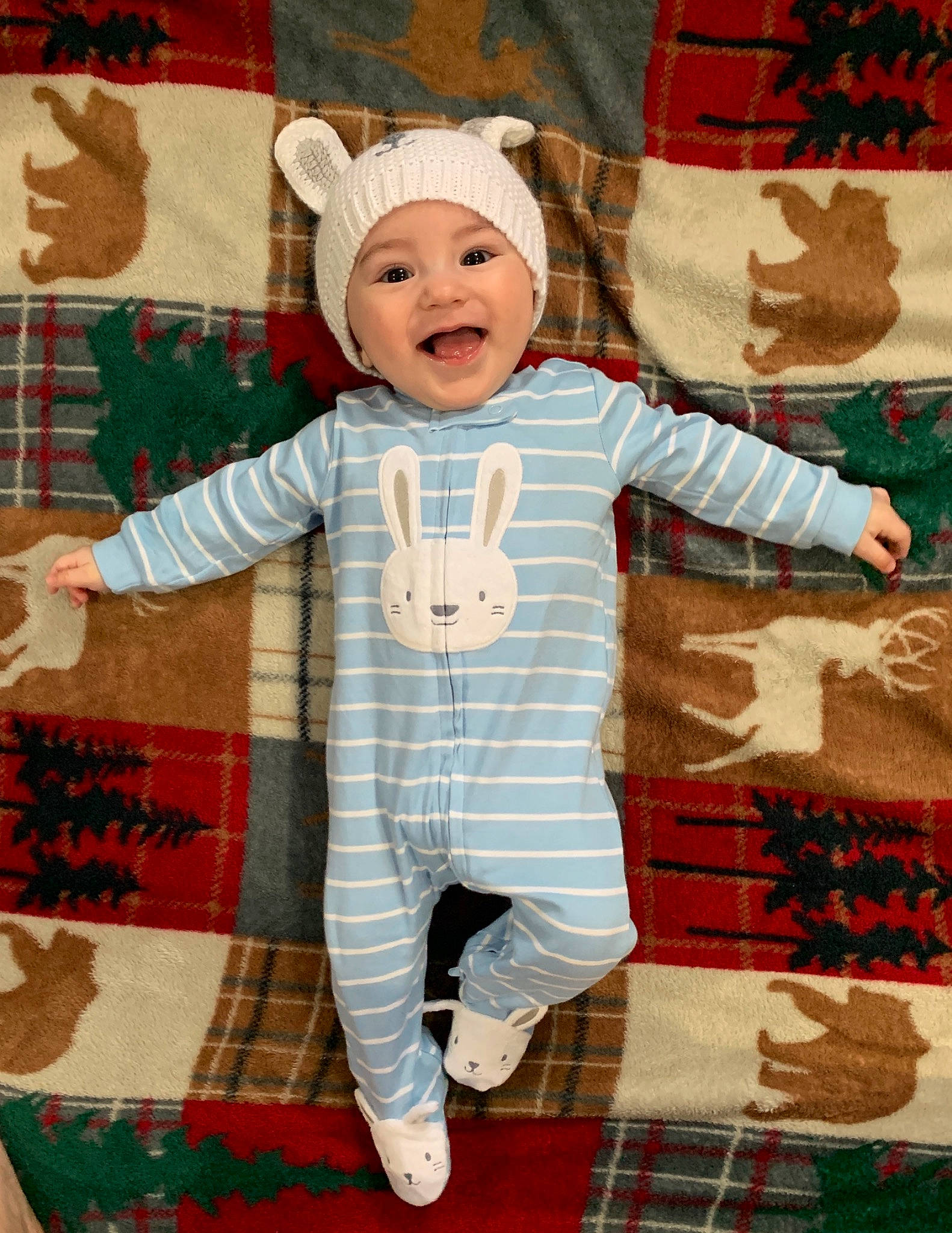 Maximiliano is registered to the contest to win money with this photo: art, baby, child, christmas, design, headwear, linens, pattern, person, plaid, textile, toddler