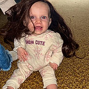 Wrenlee joined the competition — help win amazing prizes! baby, child, wig, carpet, indoor, person, clothing, sitting, smile, red_eye, hand, jeans, adult, long_hair, foot, face, happy, home, casual, light
