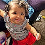Analaya joined the competition — help win amazing prizes! toddler, child, curly_hair, striped_clothing, red_shorts, smiling, indoor, carpet, couch, bag, baby_products, footwear, person, happy, playing, cute, young_child, home, bright_colors, casual_wear