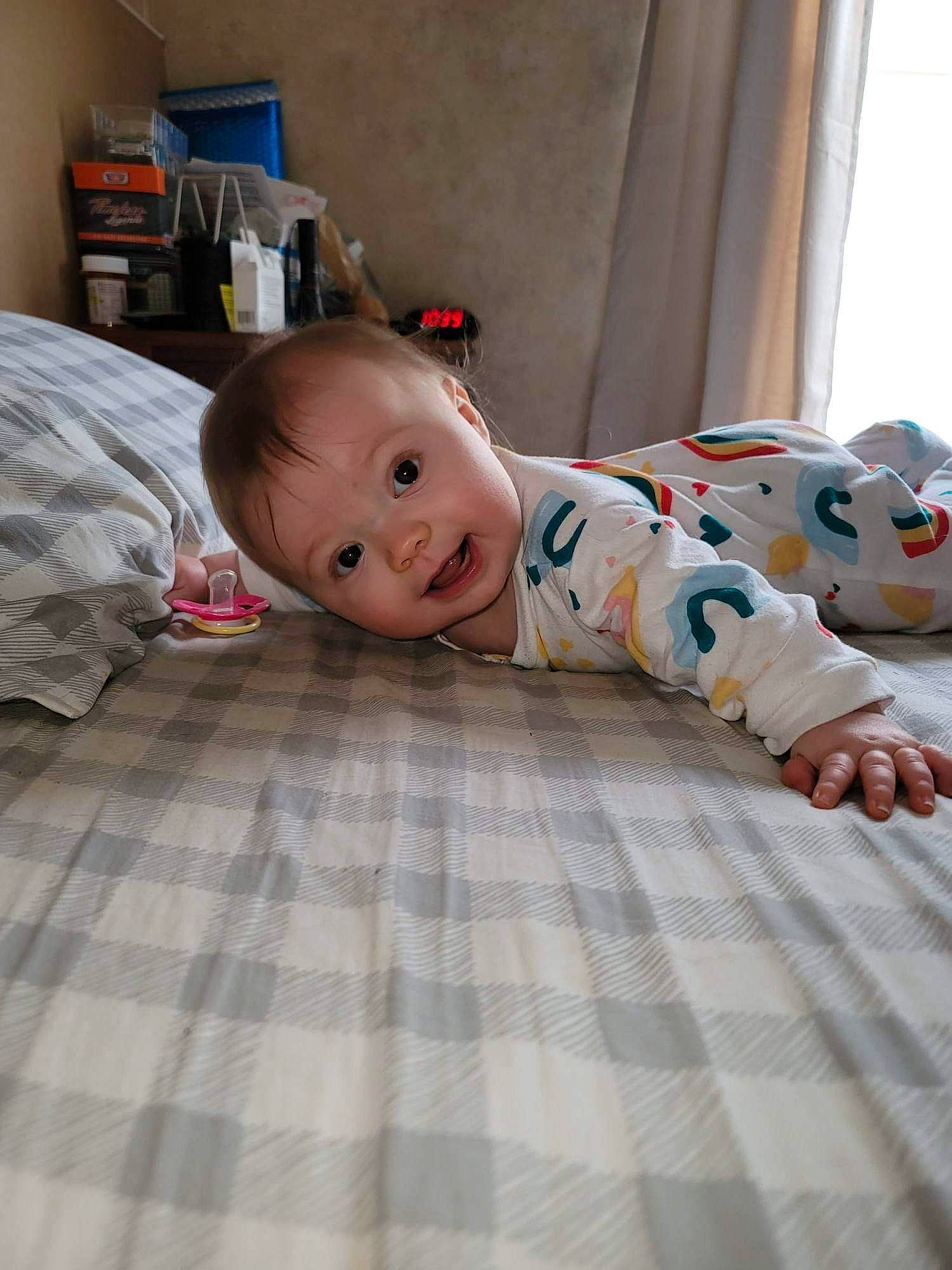 Morgan joined the competition — help win amazing prizes! baby, baby_toddler_clothing, bedding, bookcase, child, comfort, crawling, floor, flooring, hardwood, linens, mammal, pattern, person, room, shelf, skin, smile, textile, toddler