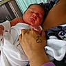 Phantaisa is registered to the contest to win money with this photo: baby, newborn, infant, hand, tattoo, blanket, sleeping, person, indoor, closeup, skin, holding, resting, cozy, comfort, parent, love, peaceful, portrait, human