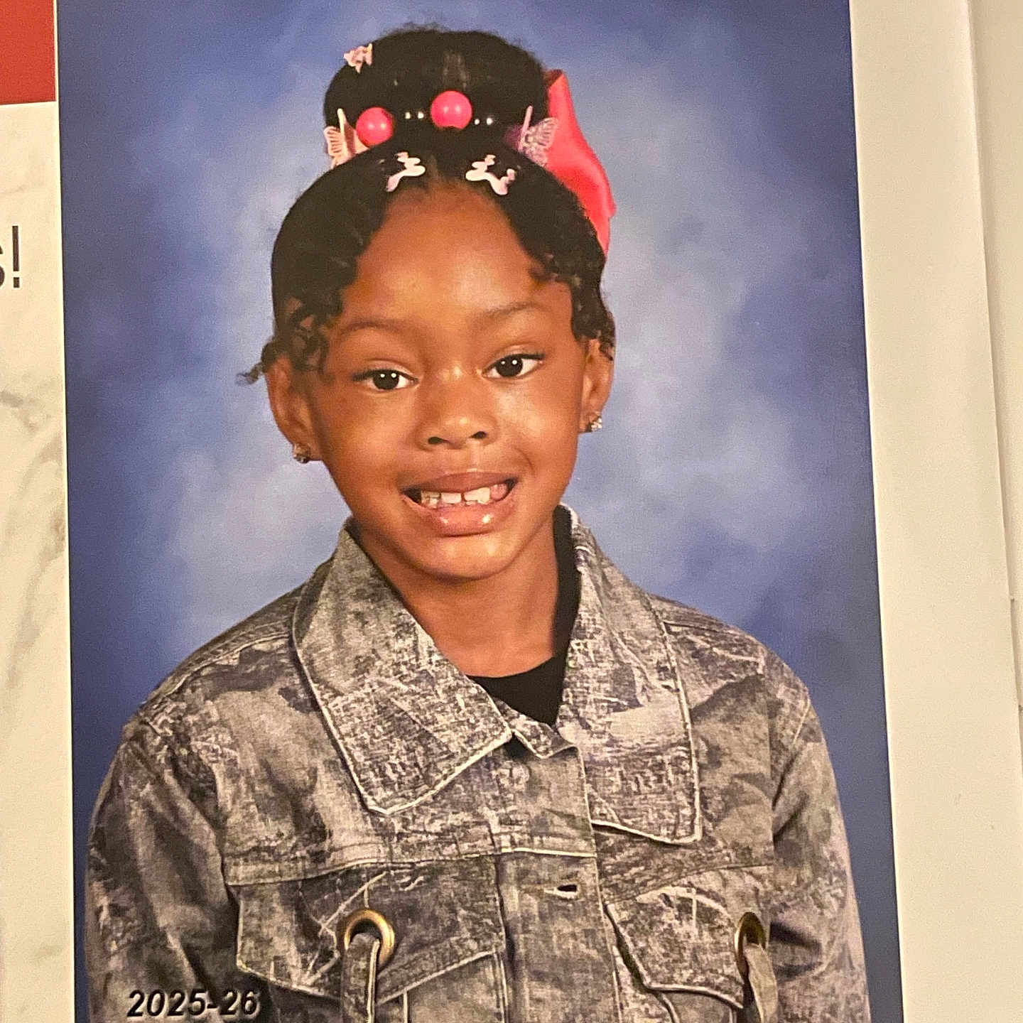 Tilyah joined the competition — help win amazing prizes! blue_background, casual_wear, child, color_photo, curly_hair, cute, denim_jacket, earrings, fashion, front_view, girl, hair_accessories, happy, person, portrait, posing, school_photo, smile, studio_photo, young