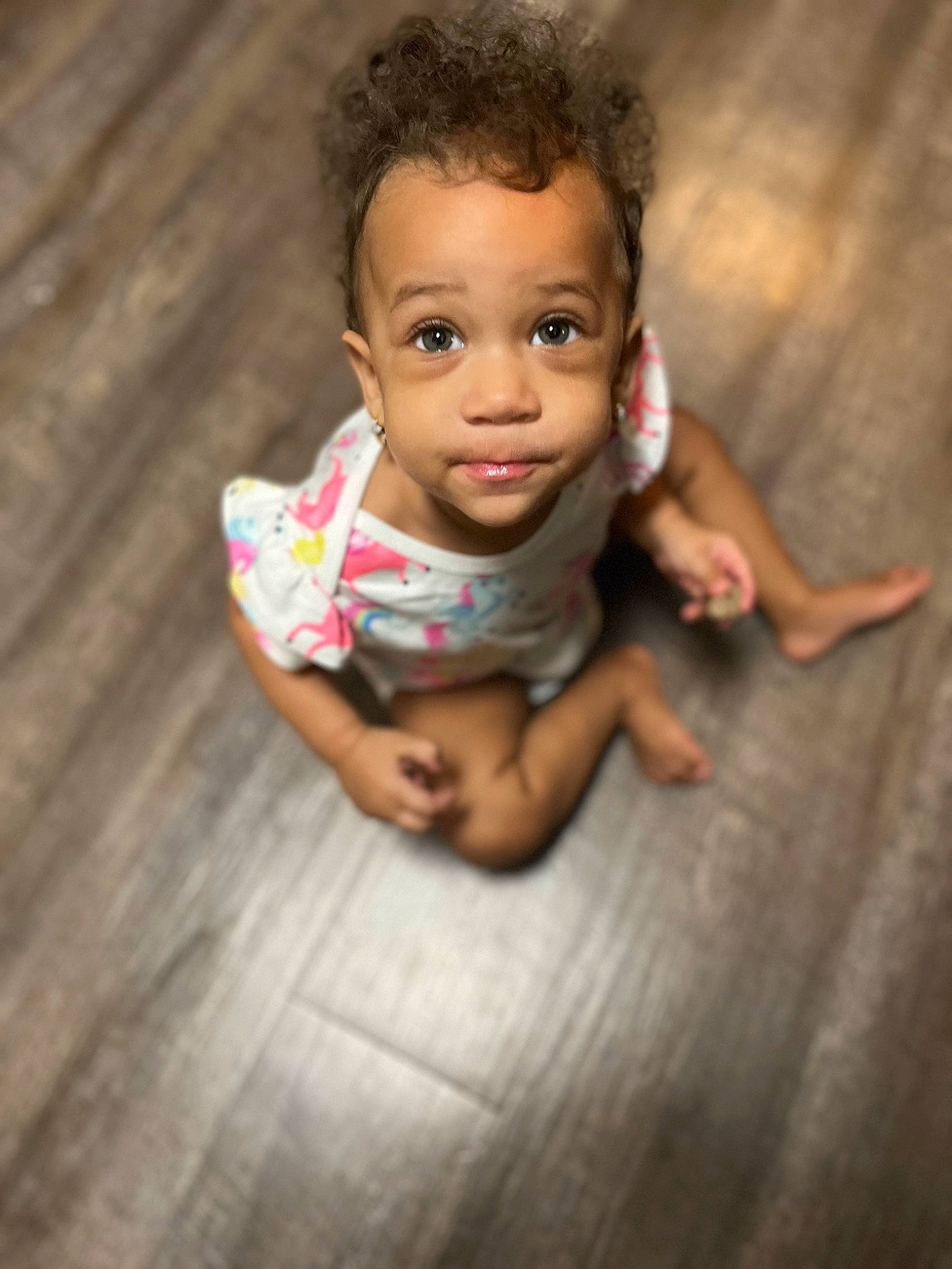 Nyla is registered to the contest to win money with this photo: baby, baby_toddler_clothing, child, face, finger, flash_photography, flooring, hand, happy, hardwood, head, human_body, lip, nose, people_in_nature, person, plant, skin, toddler, tree