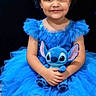 Charlotte joined the competition — help win amazing prizes! child, girl, blue_dress, tutu, curly_hair, silver_bows, plush_toy, stitch, bench, smile, portrait, sitting, cute, happy, indoor, dark_background, toy, childhood, person, fashion