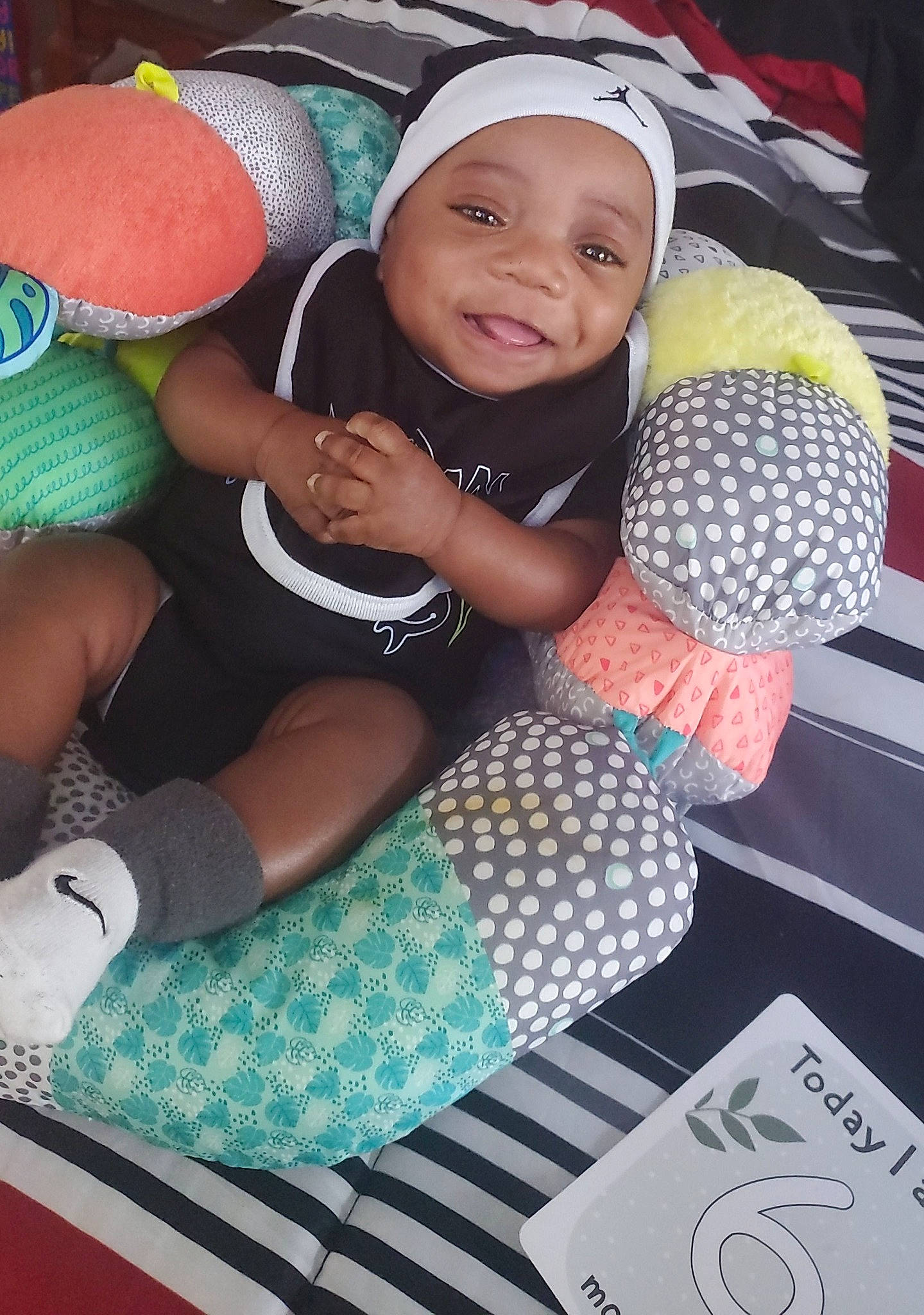 Jeremiah joined the competition — help win amazing prizes! baby, baby_toddler_clothing, cap, child, eye, fun, green, happy, headgear, headwear, human_leg, leisure, pattern, person, shorts, smile, sock, t_shirt, textile, thigh