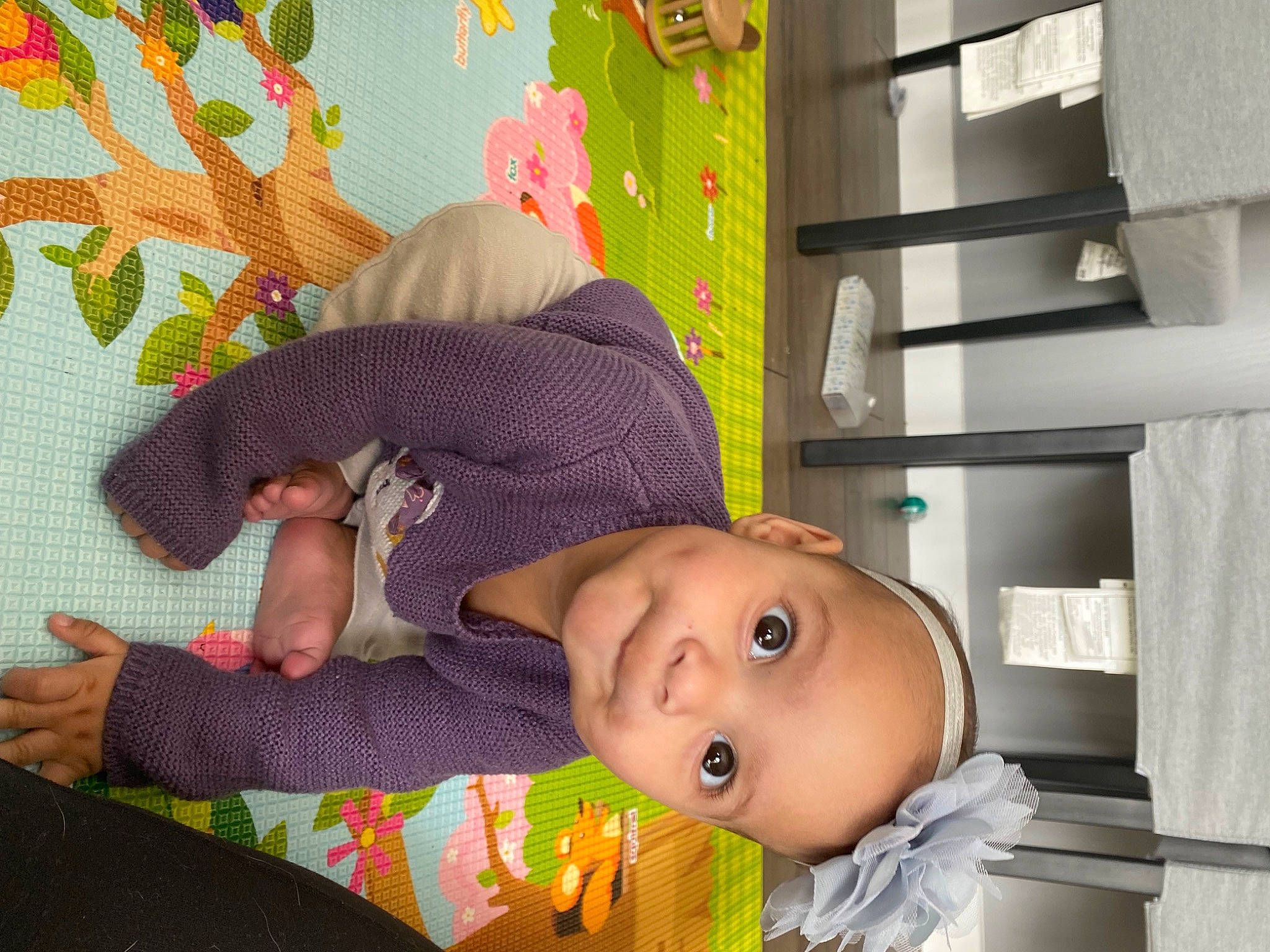 Gaia is registered to the contest to win money with this photo: baby, baby_products, baby_safety, baby_toddler_clothing, child, comfort, flooring, fun, happy, hat, head, linens, pattern, person, room, shelving, skin, smile, toddler, toy