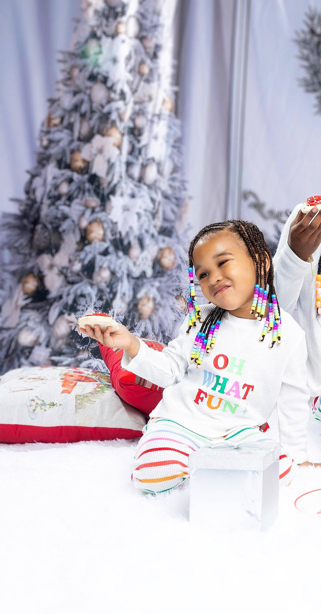 Cailey is registered to the contest to win money with this photo: baby, baby_toddler_clothing, child, christmas_decoration, christmas_tree, conifer, event, fashion, freezing, fun, happy, joy, leisure, person, recreation, sitting, sleeve, smile, table, toddler