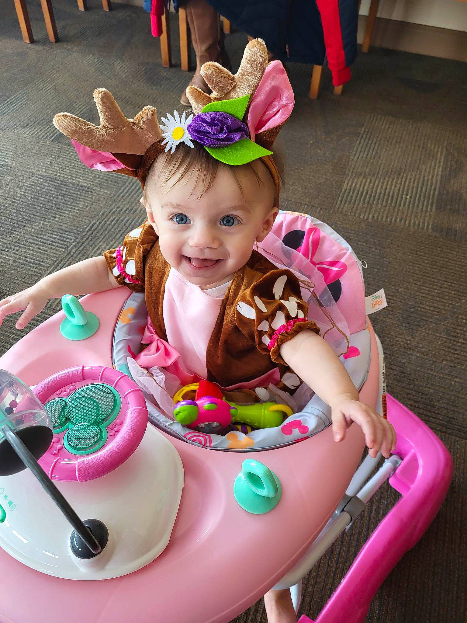 Lillianna joined the competition — help win amazing prizes! baby, baby_products, child, event, facial_expression, fashion_accessory, fun, green, happy, headband, joy, leisure, magenta, person, pink, play, recreation, riding_toy, smile, sweetness