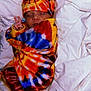 baby, sleeping, peace_sign, tie_dye, blanket, hat, colorful, infant, bed, bedding, cute, peaceful, wrapped, soft, newborn, child, portrait, cozy, rest, warm