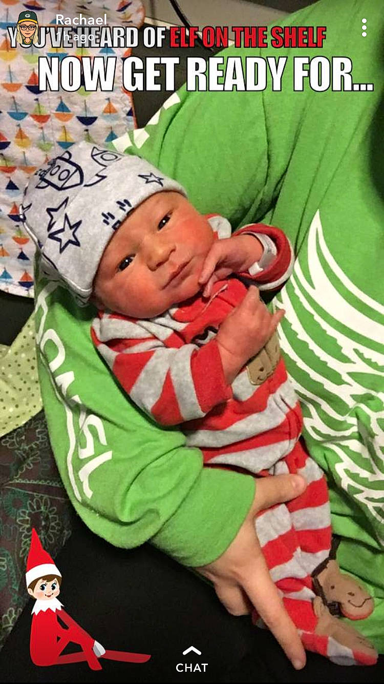 Mylo is registered to the contest to win money with this photo: child, christmas, fictional_character, headwear, infant, person, photo_caption, product, toddler