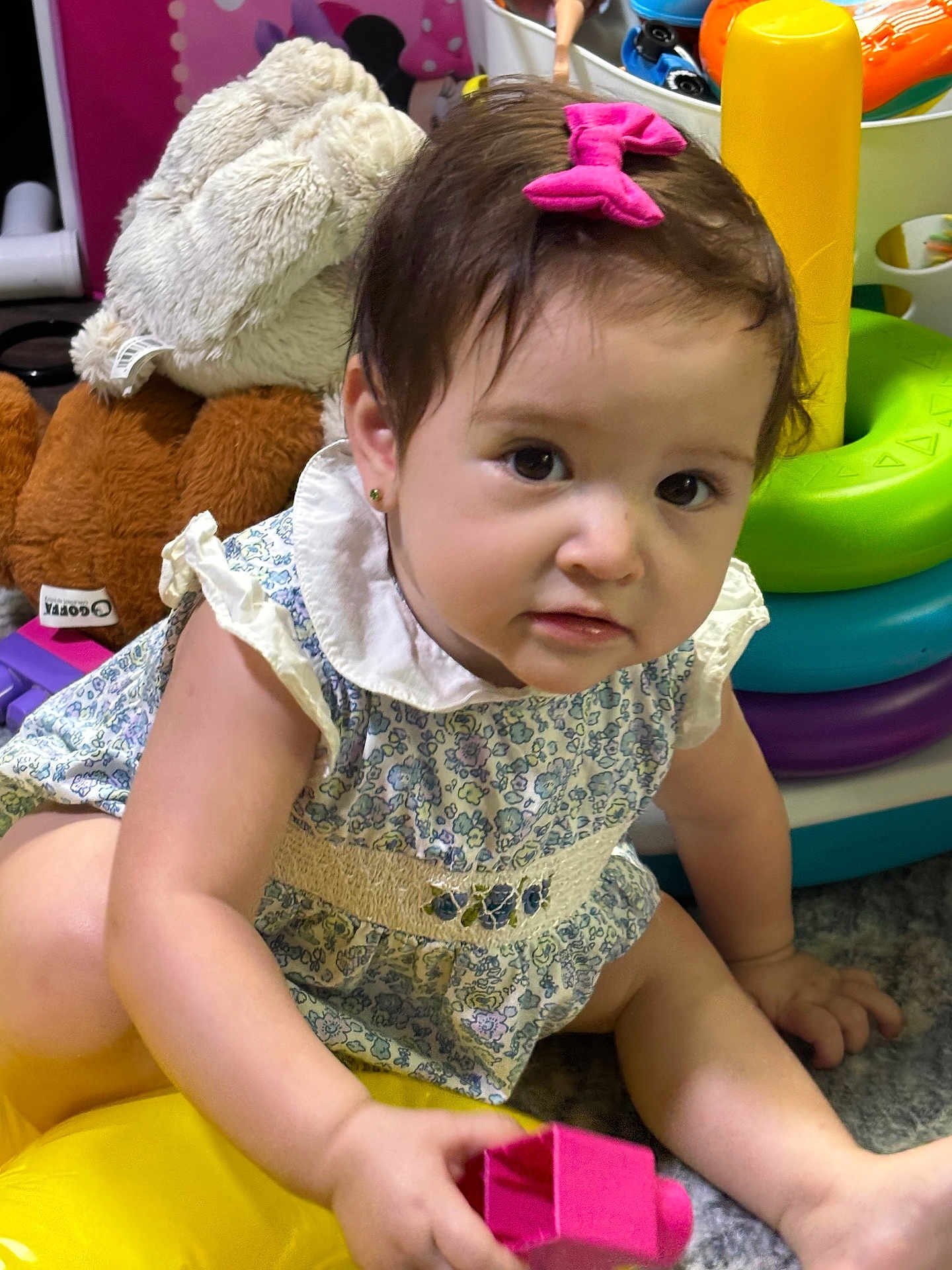 Winter joined the competition — help win amazing prizes! baby, child, girl, pink_bow, toy_block, stuffed_animal, colorful_toys, floor, curly_hair, blue_dress, white_collar, earrings, playtime, indoors, carpet, cute, smiling, young_child, portrait, closeup