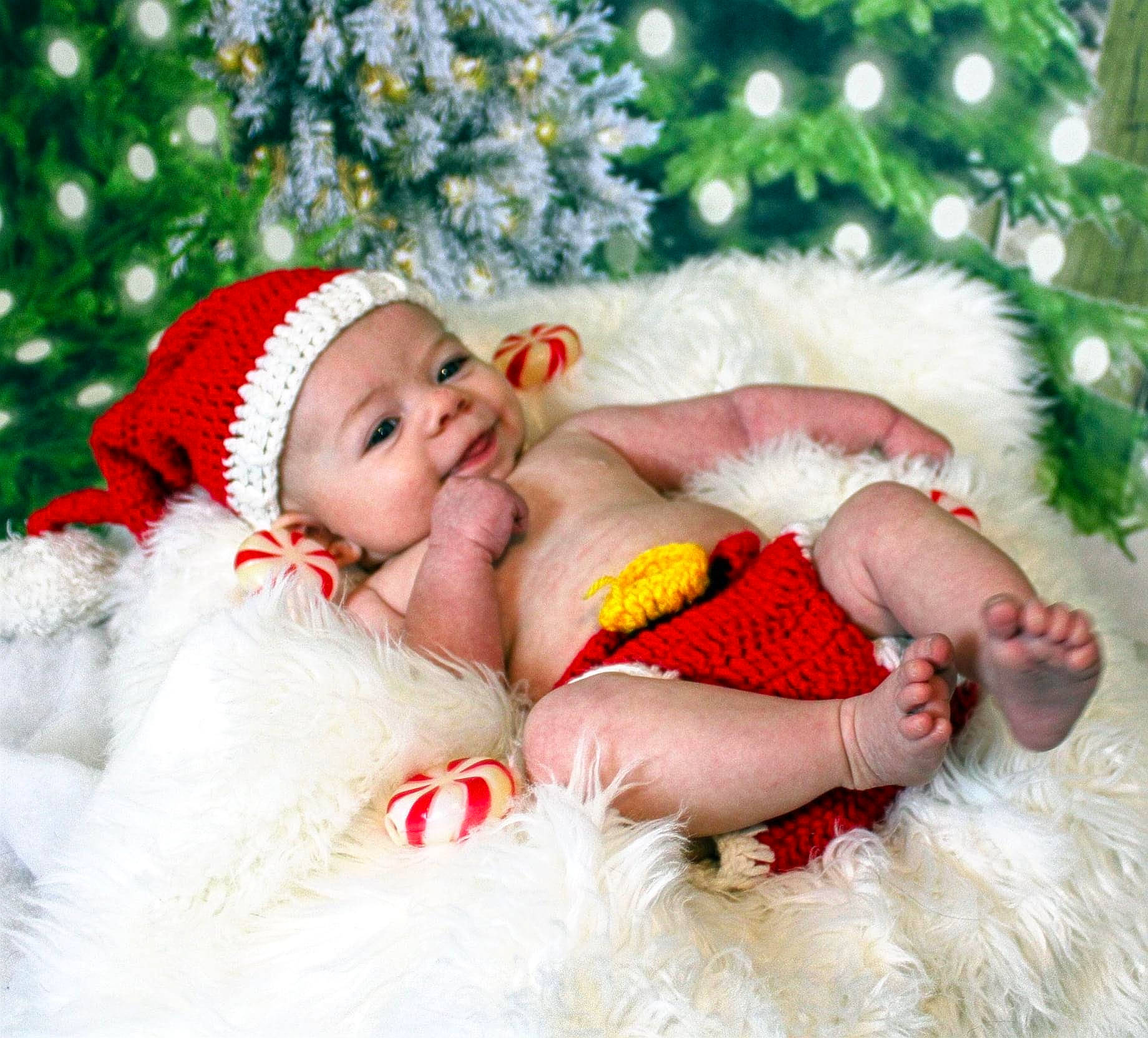 Caydance joined the competition — help win amazing prizes! baby, baby_toddler_clothing, bonnet, child, christmas, christmas_decoration, christmas_eve, christmas_tree, conifer, costume_accessory, event, fictional_character, fir, fur, happy, headwear, holiday, human, love, person