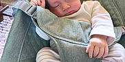 Louie joined the competition — help win amazing prizes! baby, baby_seat, child, comfort, cozy, cute, feet, green, hair_tuft, hands, indoor, infant, peaceful, portrait, relaxed, resting, sleeping, soft_fabric, striped_pants, white_socks